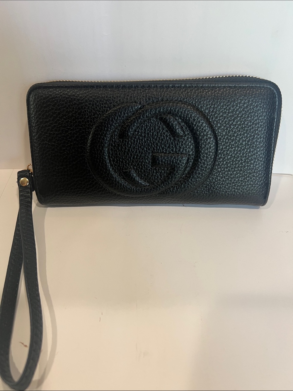 GG Collection Black Pebbled Leather Zip Wristlet with Raised Logo